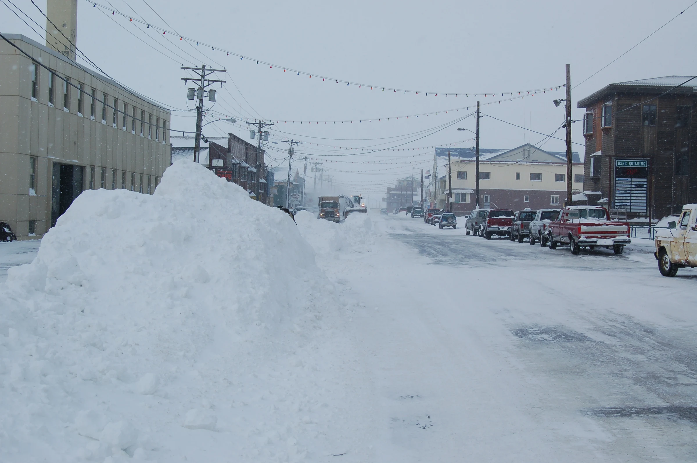 Snow piled along Front Street in Nome, photographed in March 2006